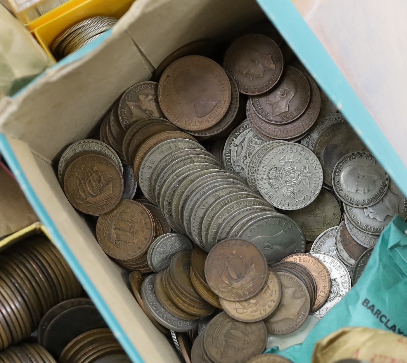 A box of UK and World coins including George V and George VI florins, shillings etc